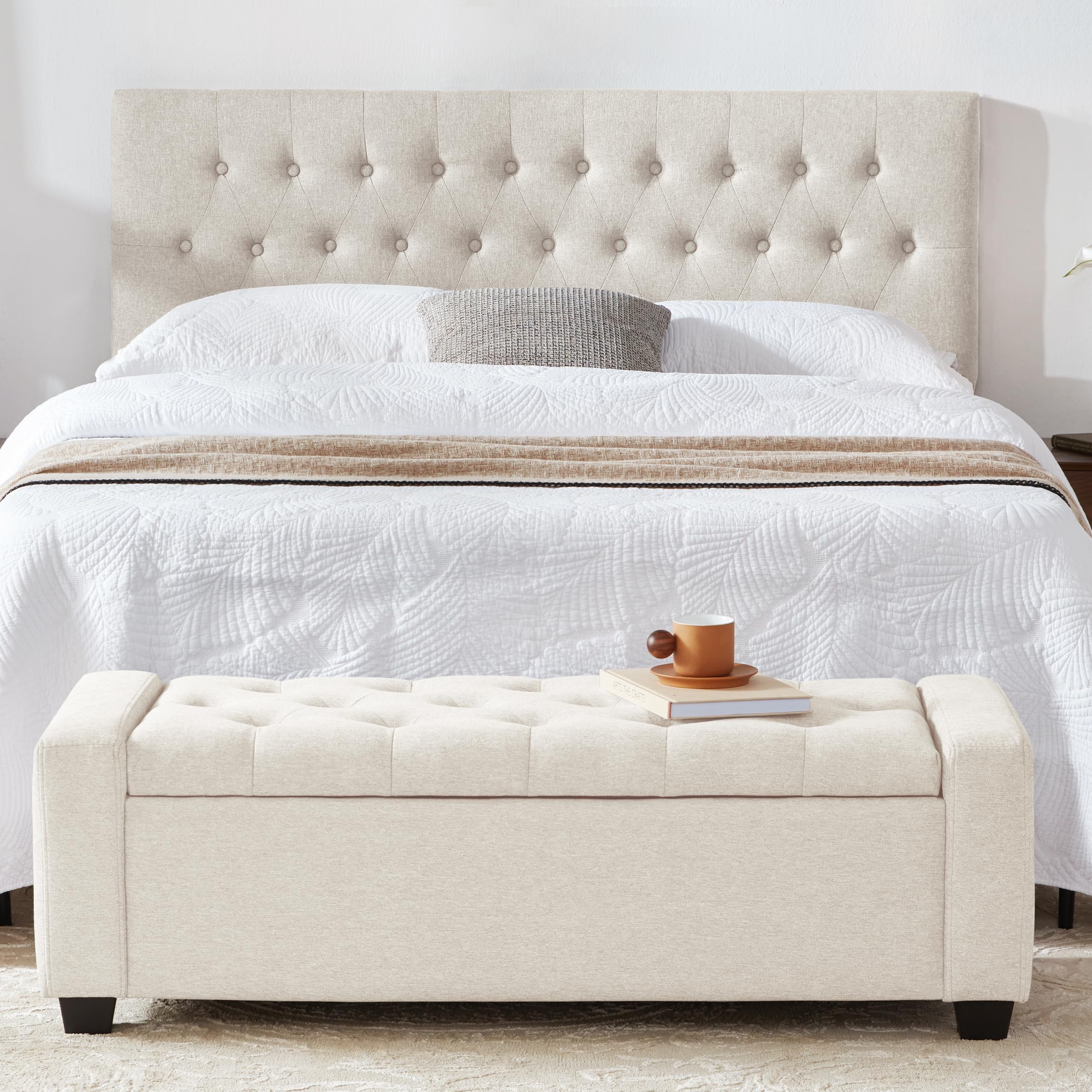 Beige ottoman with button tufting and diamond stitching