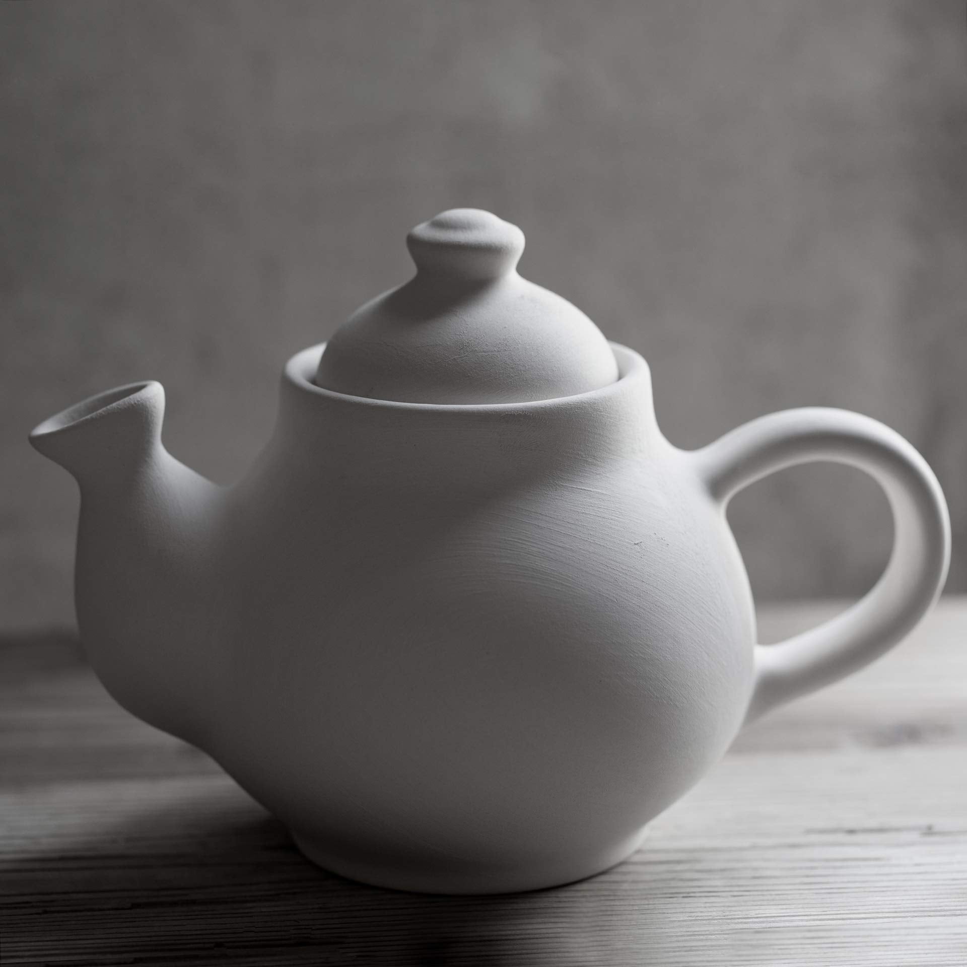Teapot for blooming and loose leaf tea on table