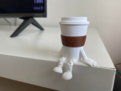 Articulated legs coffee cup sculpture for desk