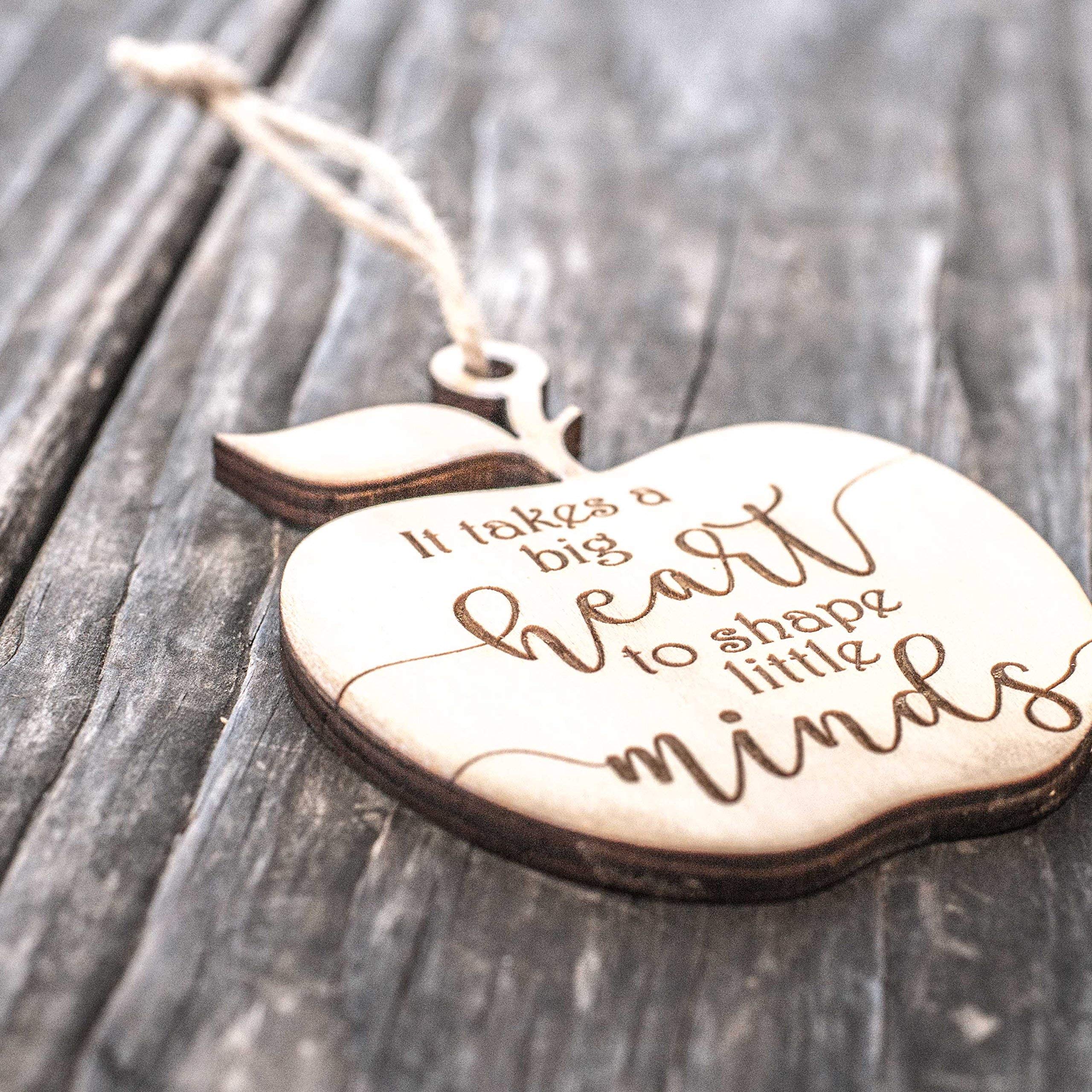 Teacher gift ornament featuring It Takes a Big Heart to Shape Little Minds message