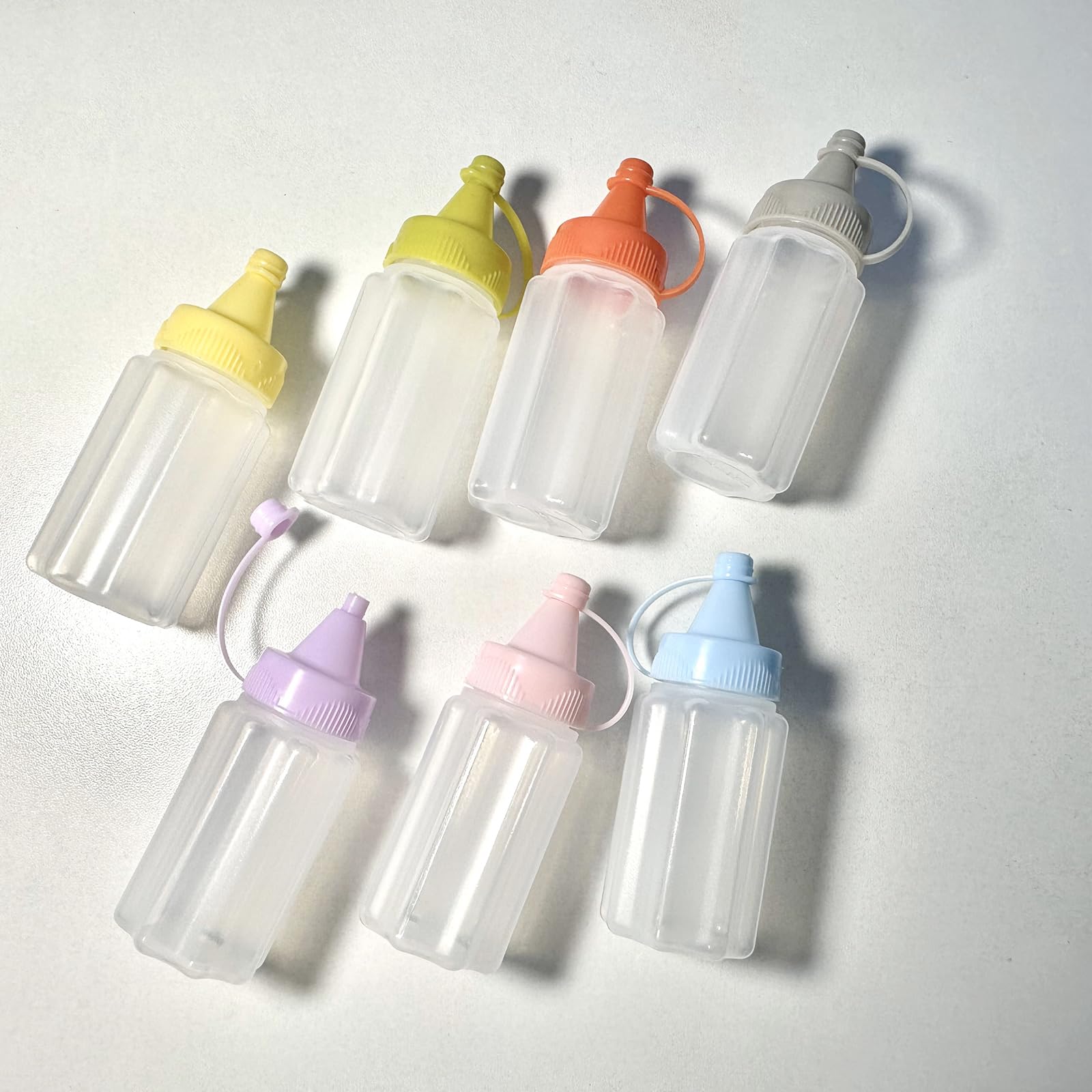 Eight 30ml mini condiment squeeze bottles in yellow color