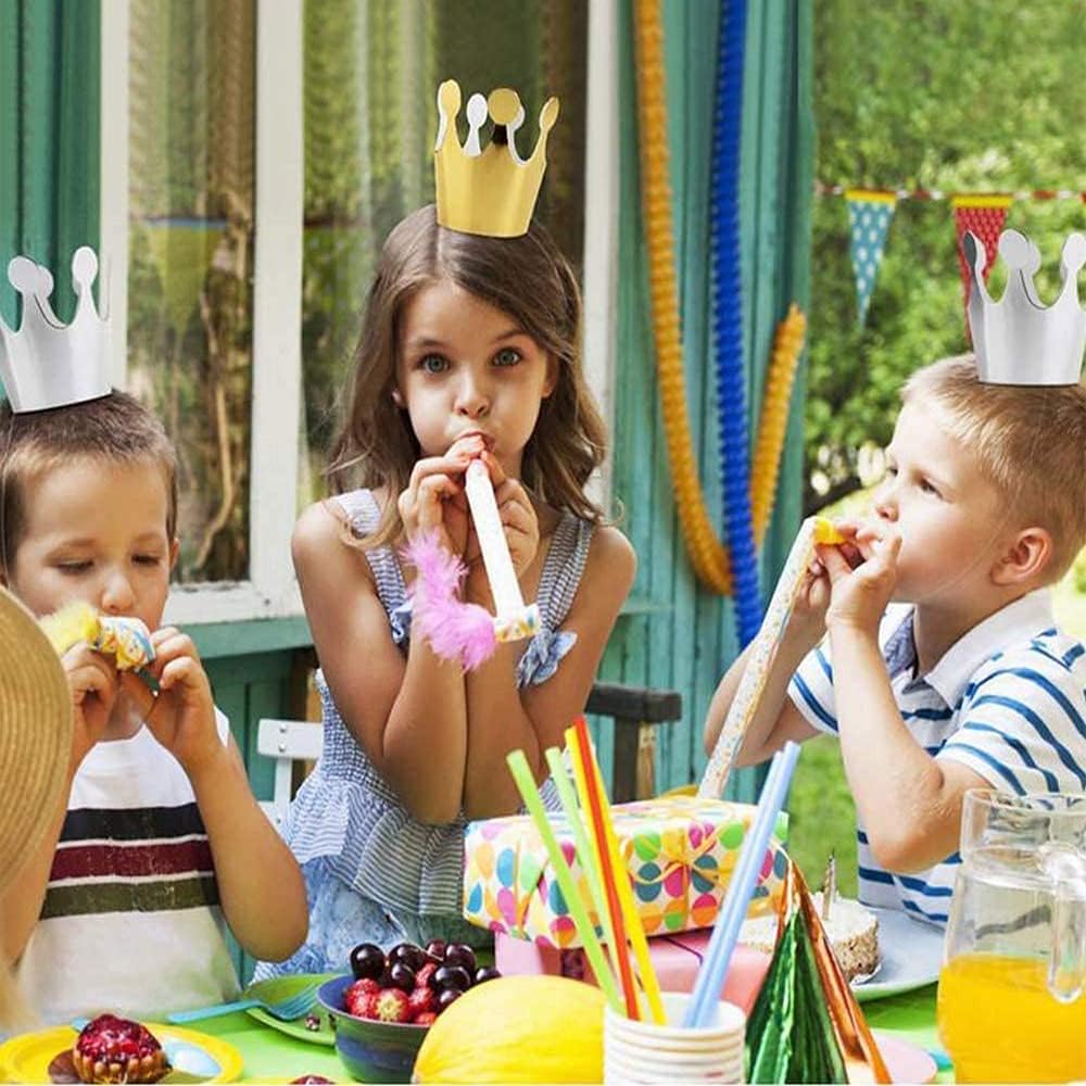 Kids and adults wearing ELakiss paper party hats