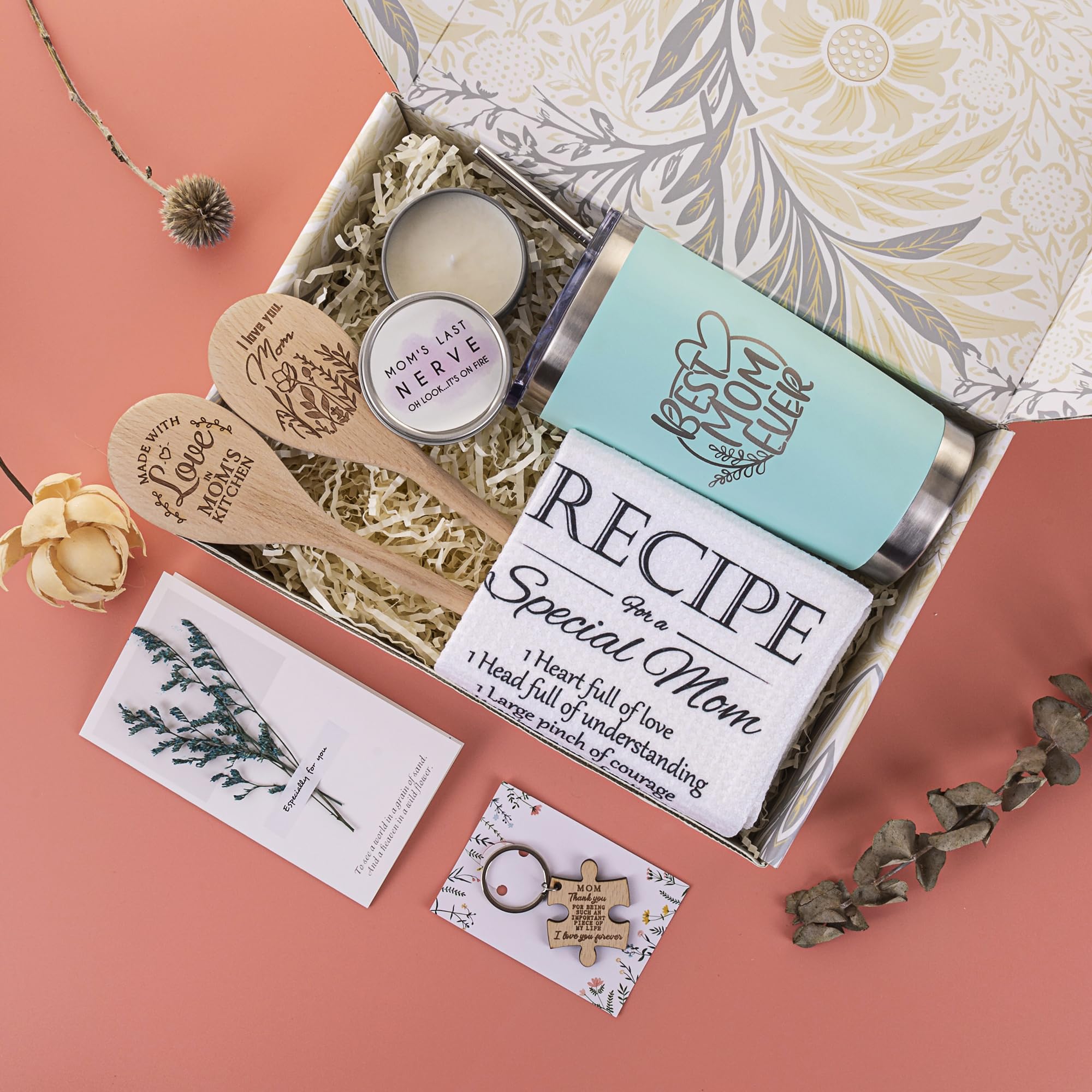 Gift basket contents including wooden keychain towel candle spoons