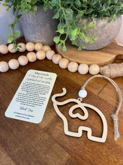 Elephant ornament with white bead and juke twine string