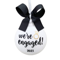 Engaged Ornament 2025 front design with white glitter background and black gold lettering and bow