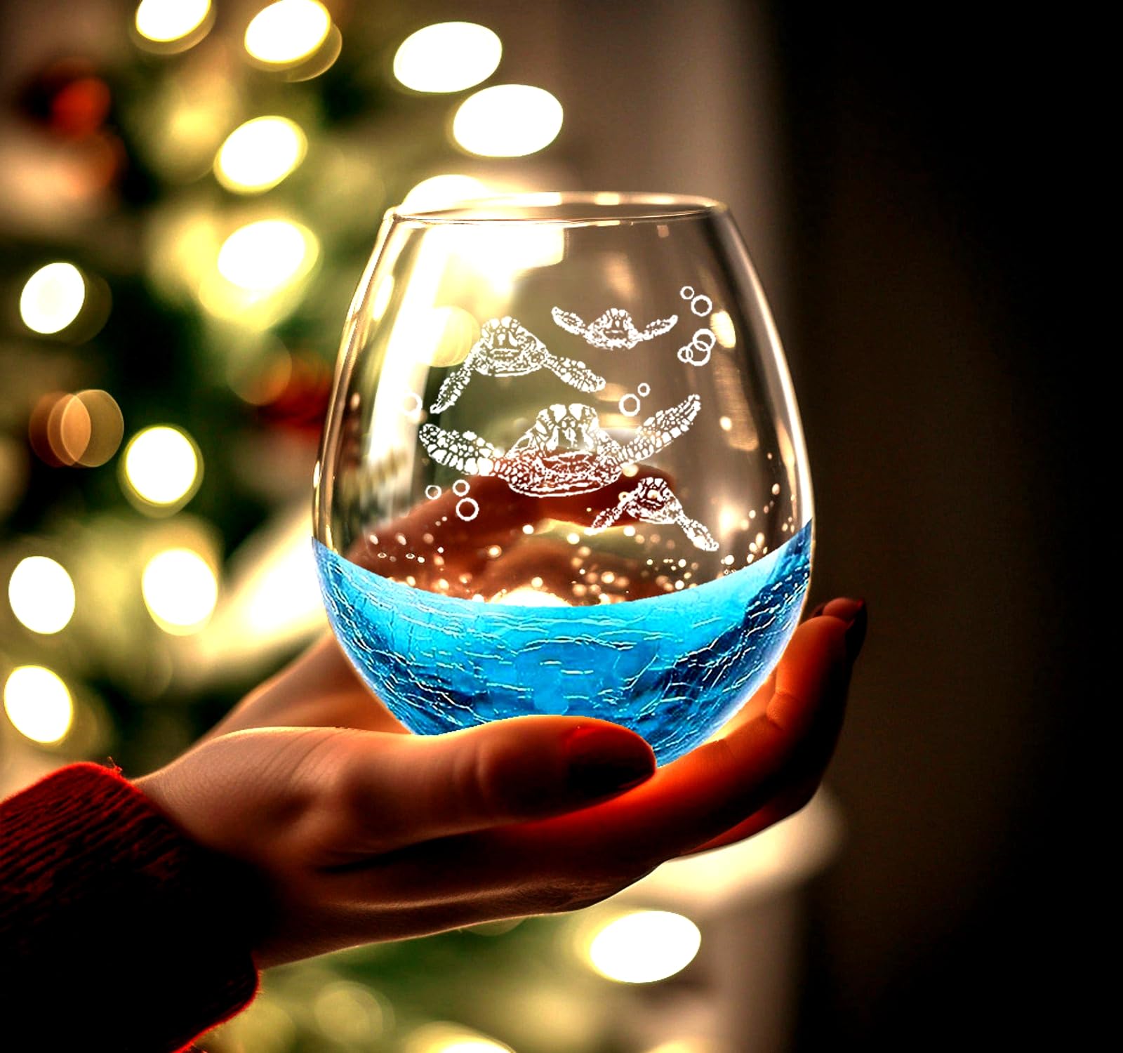 Close up of etched sea turtles design on wine glass