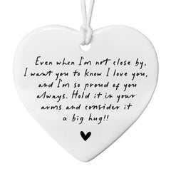 Even When I'm Not Close By white heart ceramic ornament on display