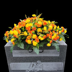 Faux floral silk grave flowers used in the memorial saddle