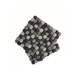 Felt ball wool trivet used as pot holder and drying mat