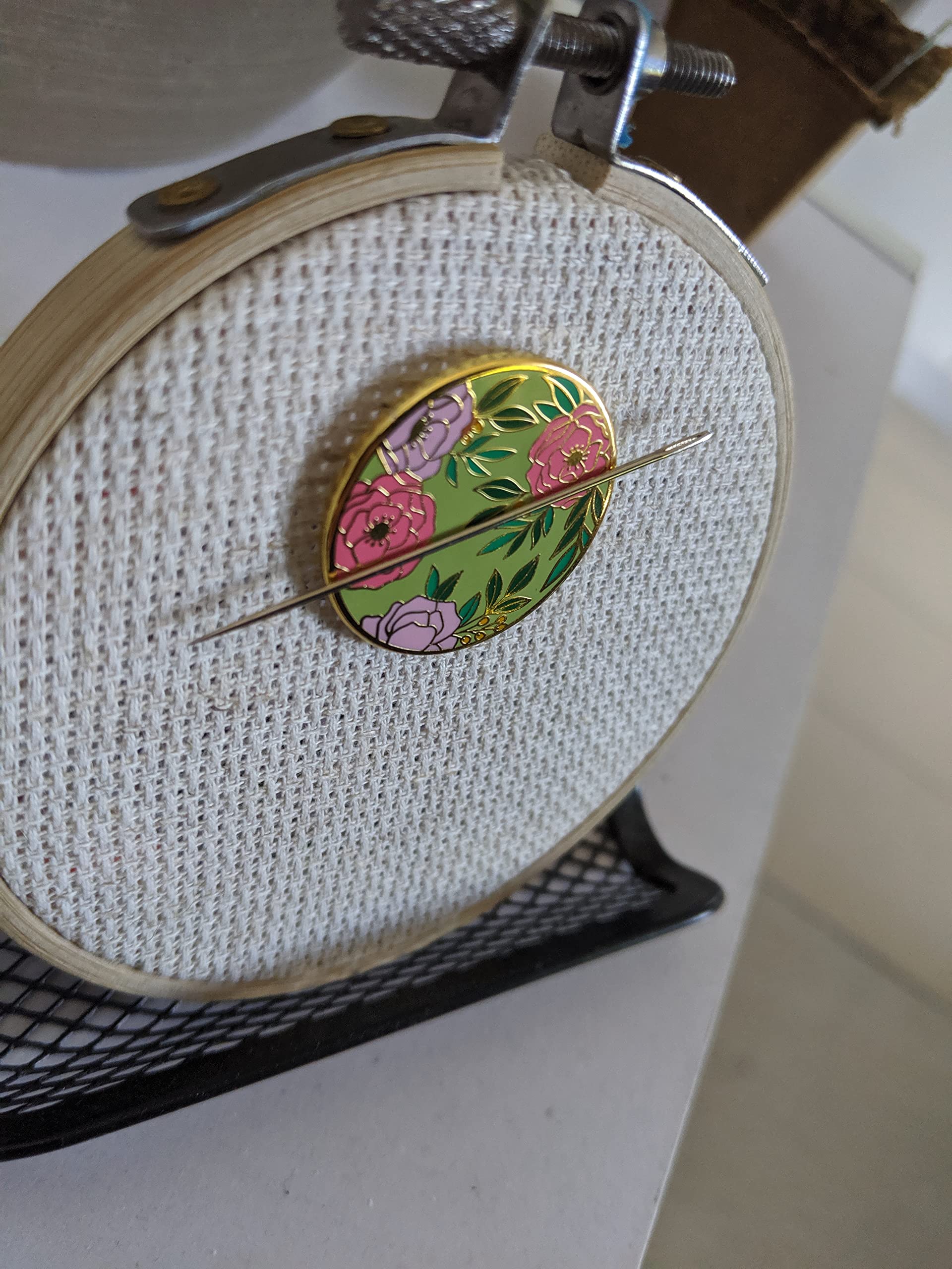Decorative Field of Flowers Needle Minder design on fabric
