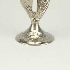 Cross shaped candlestick designed for thin taper candles