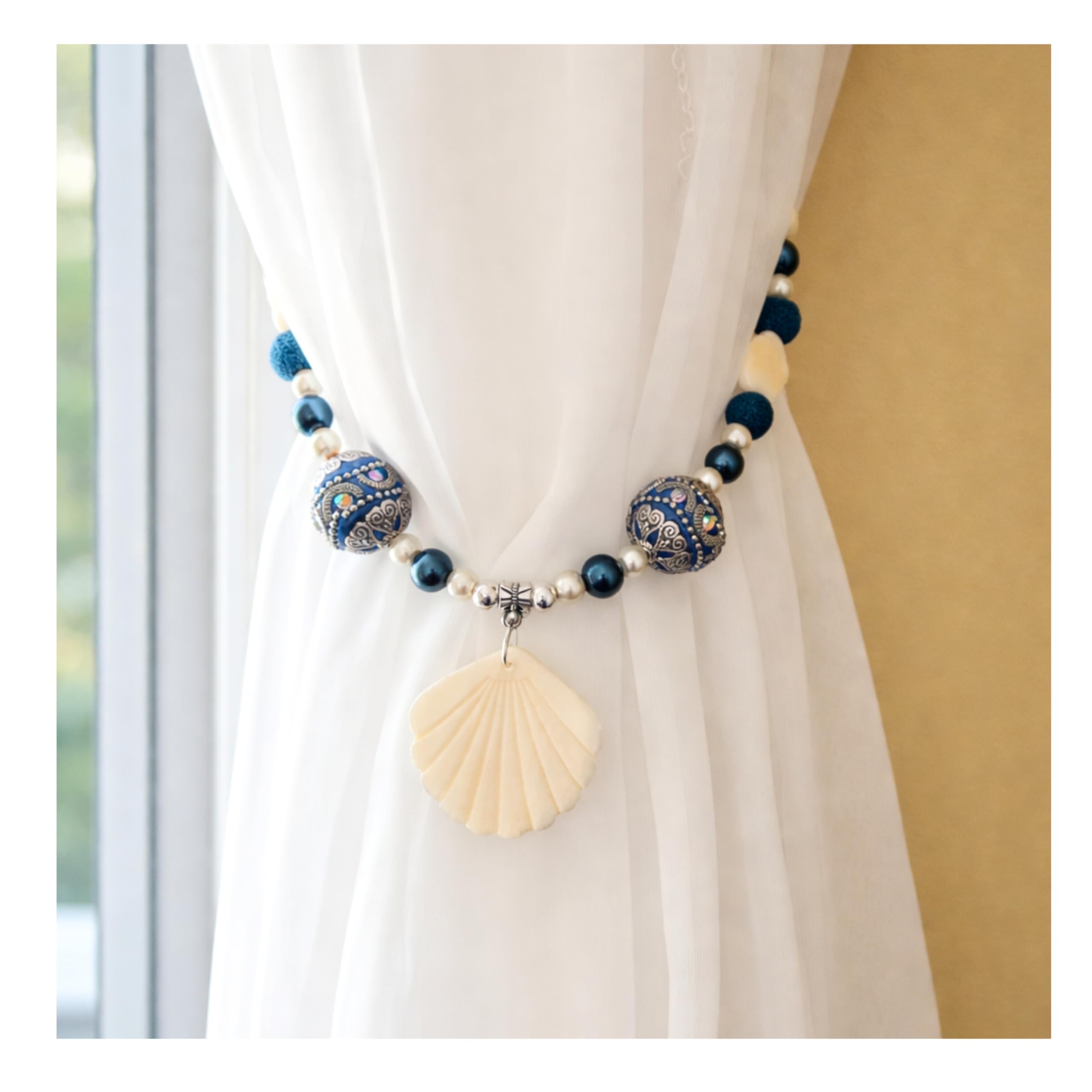 Flower shaped natural shells on curtain ties