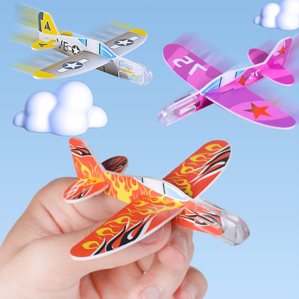 Children playing with foam airplanes outdoors