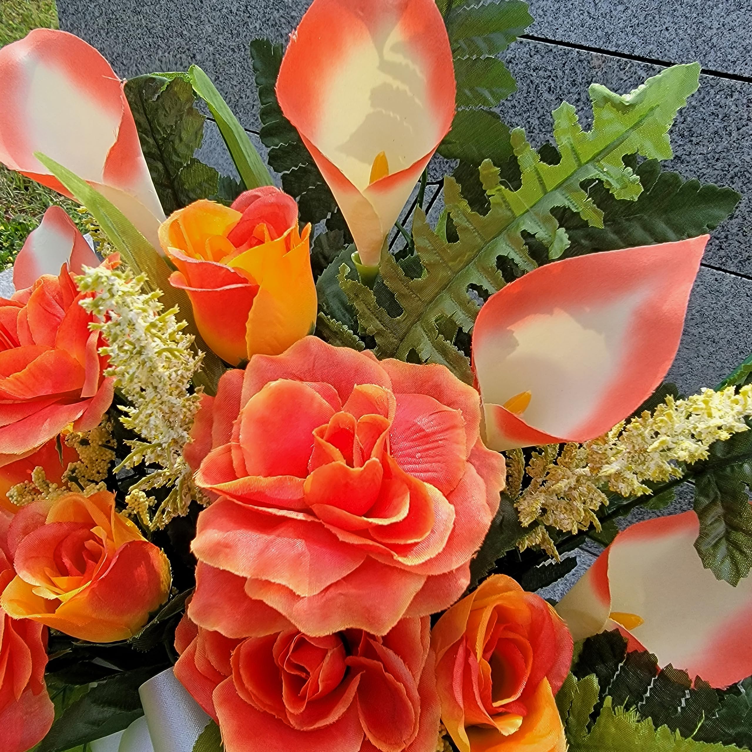 Waterproof acetate bow accents the grave flowers