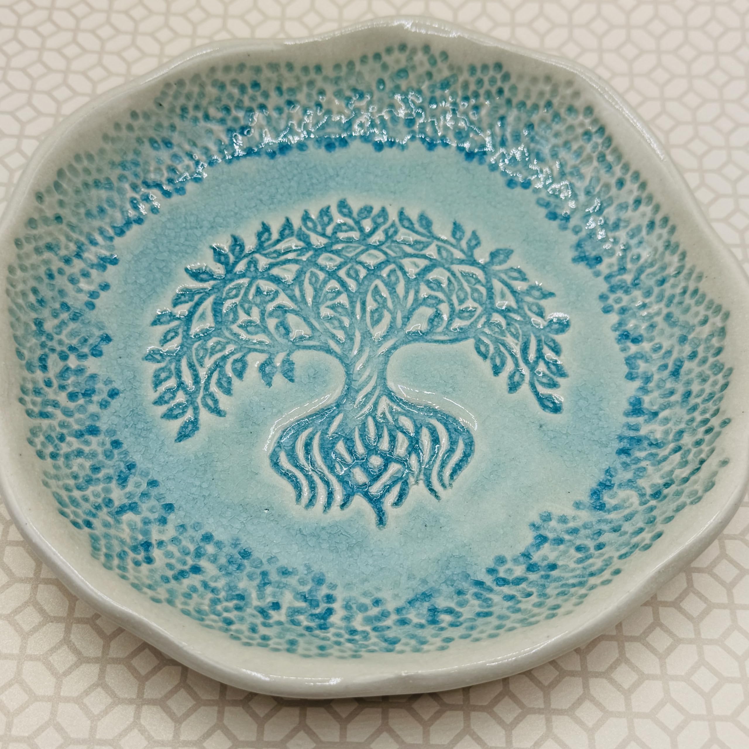 Turquoise glazed tray shown as candle holder