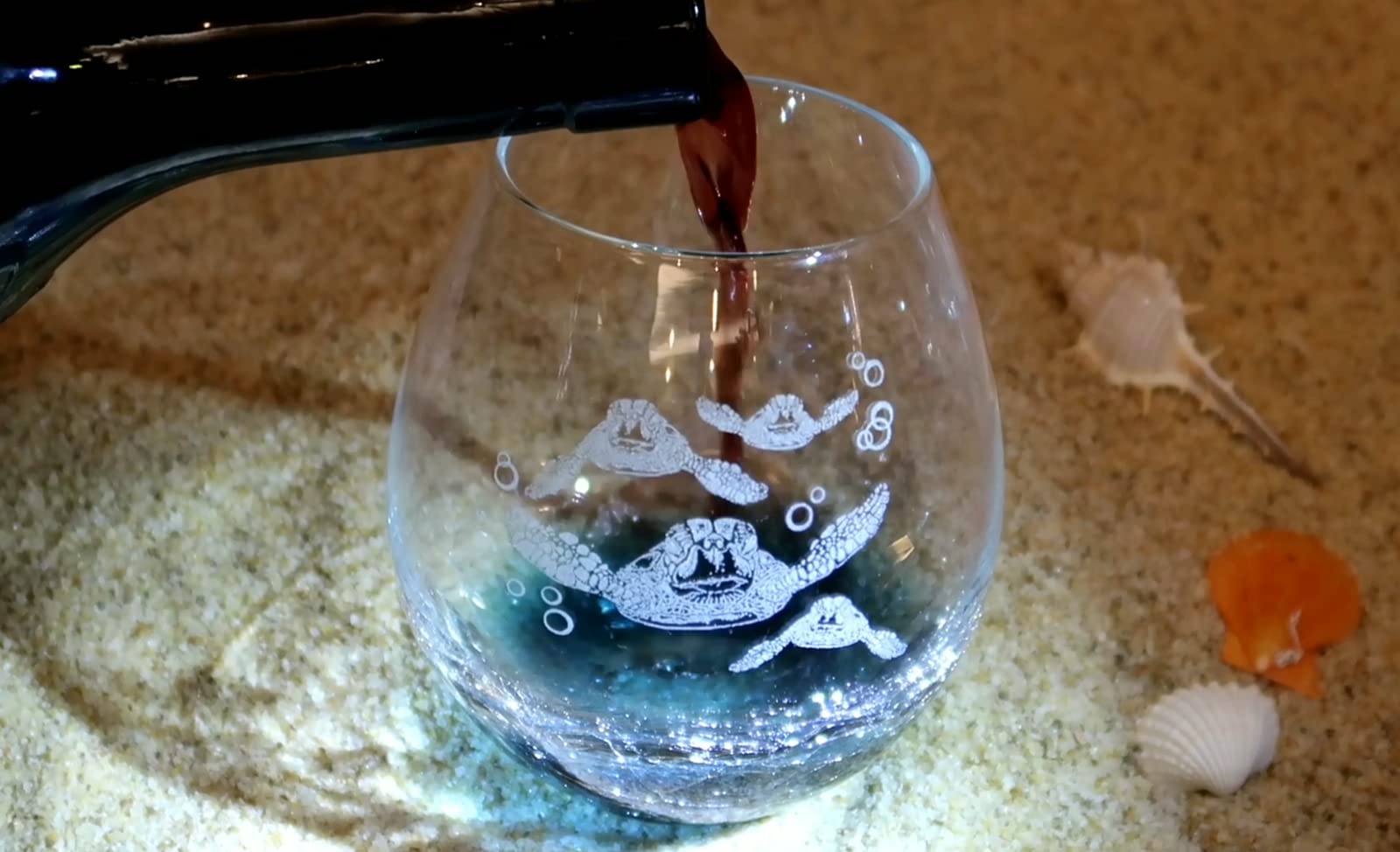Four sea turtles engraving on glass