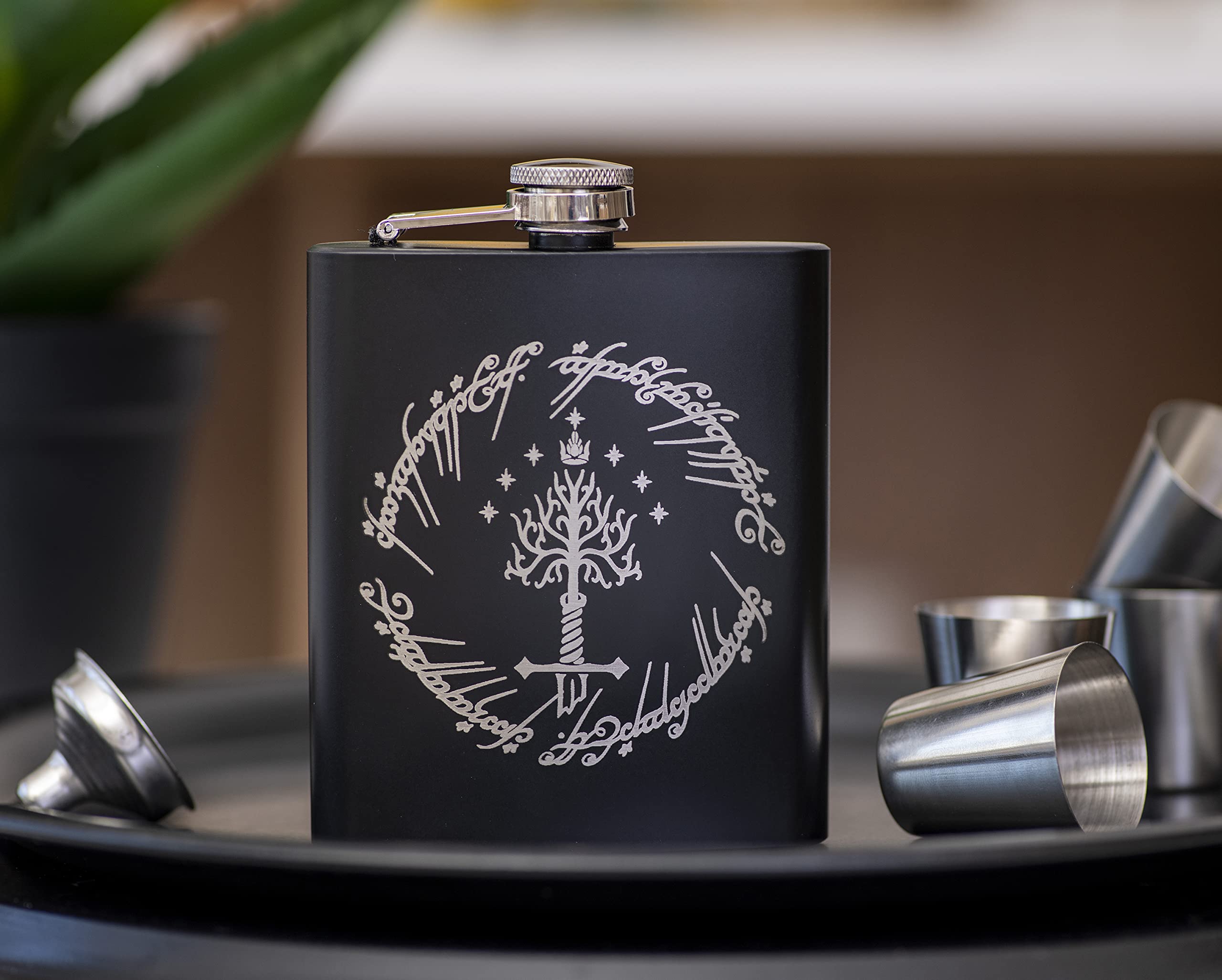 Four shot glasses included in leather case