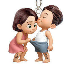 Close up of funny cartoon couple design on personalized acrylic car hanger ornament