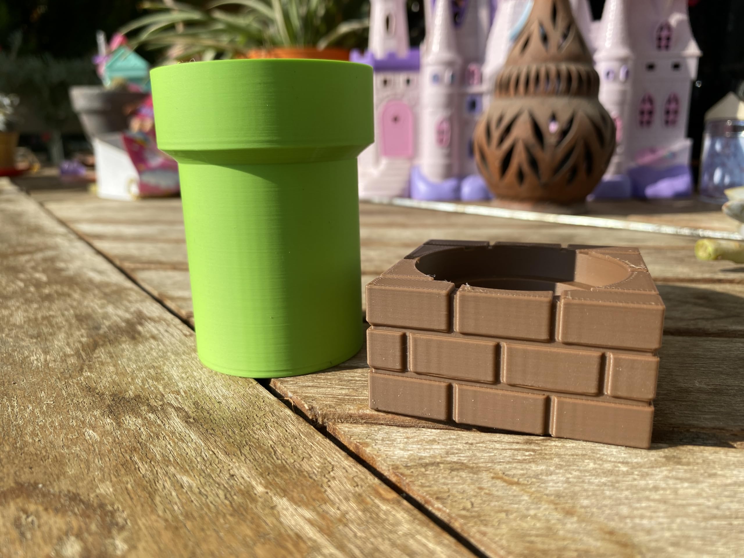 Gaming themed planter shown as desk decor on shelf