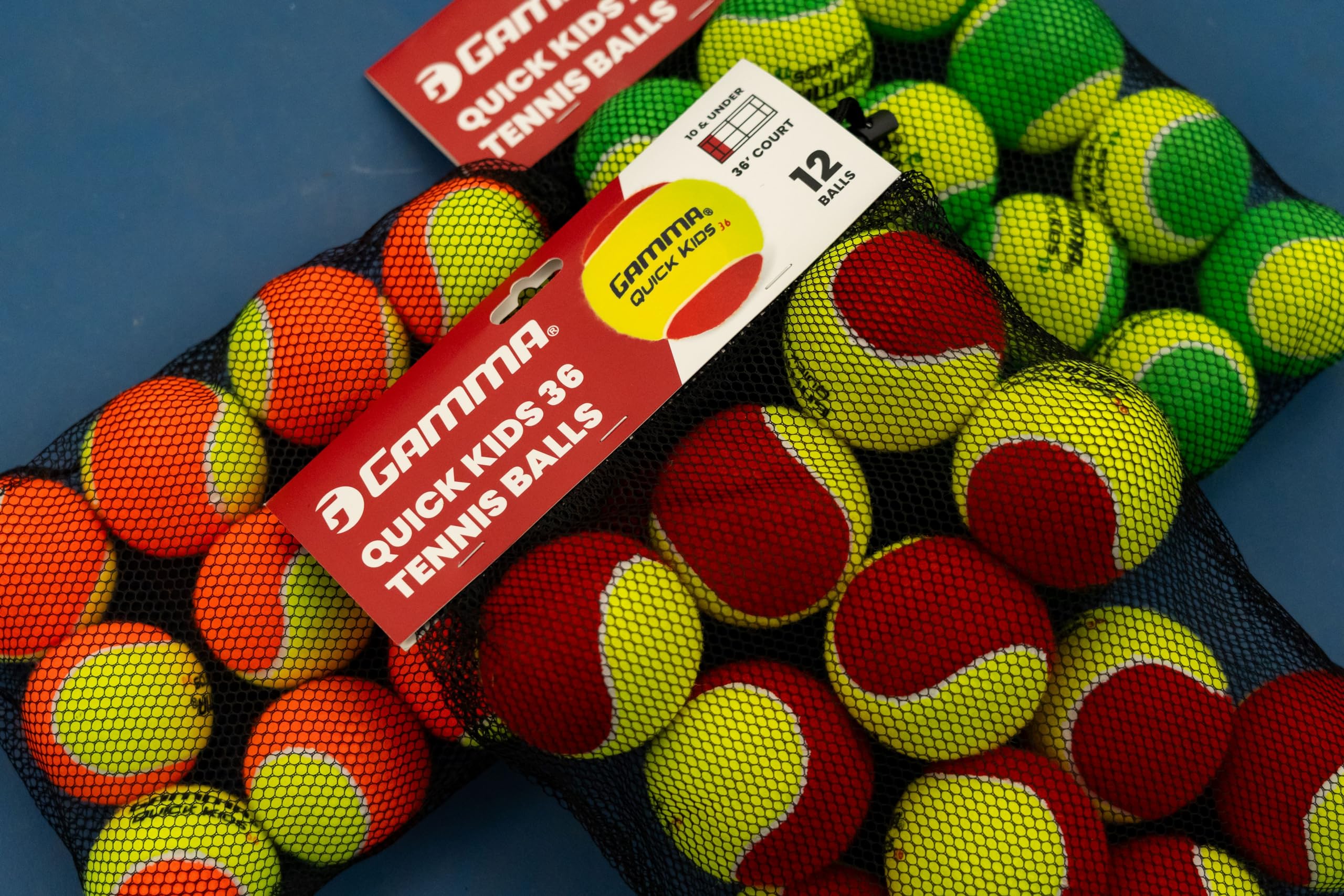 Bright yellow felt with orange dot on Gamma Quick Kids 36 tennis balls