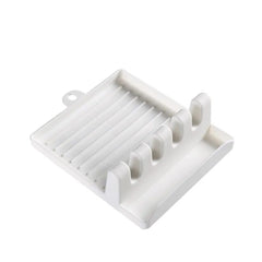 Generic Spoon Rest-12 white plastic utensil rest on kitchen counter