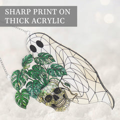 Ghost ornament hanging on Halloween tree or window