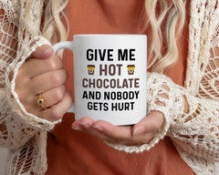 Give Me Hot Chocolate and Nobody Gets Hurt text on mug