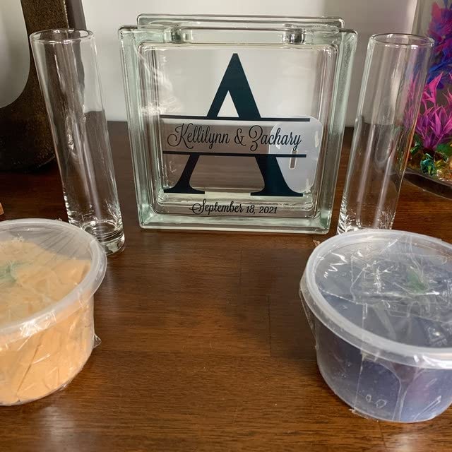 two personalized glass pouring containers included