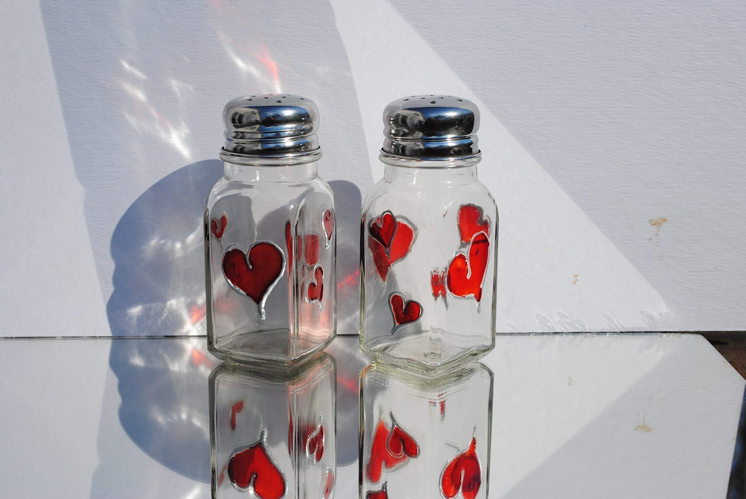 Enamel baked finish on glass salt and pepper shakers with silver tops