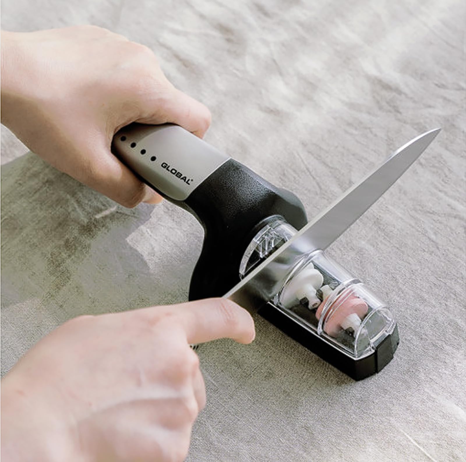 Global 2-Stage Handheld Knife Sharpener stainless steel close up coarse stage