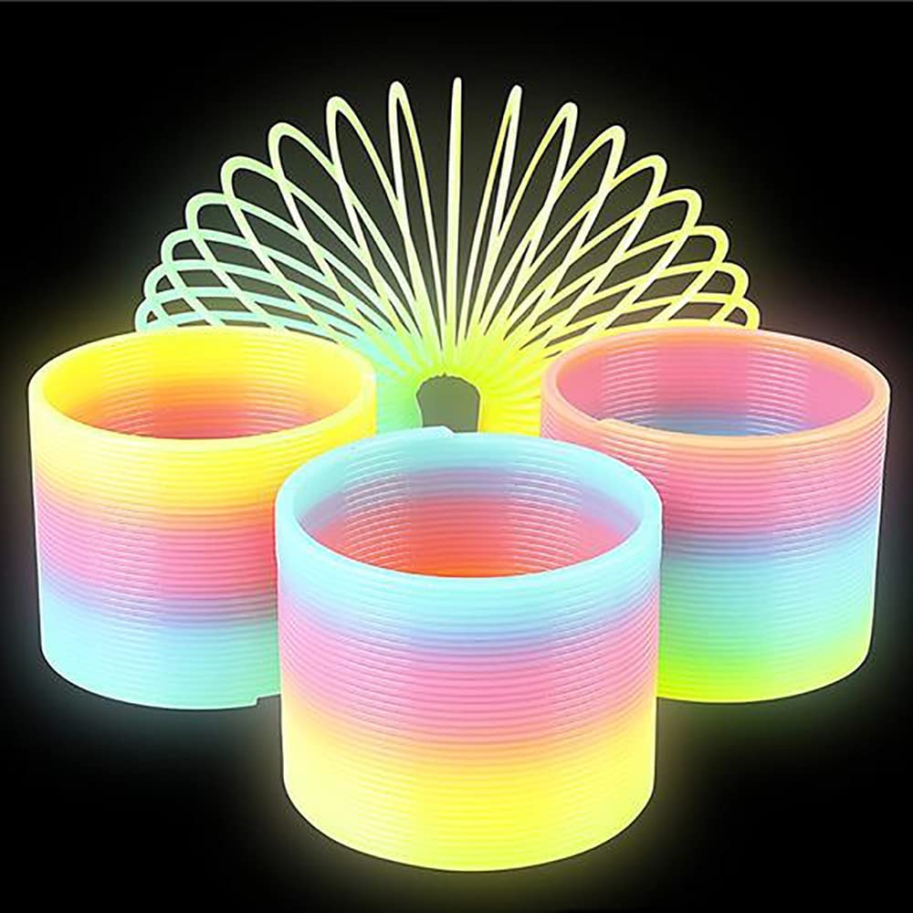 Glow-in-The-Dark Rainbow Slingy coil spring toy glowing in low light