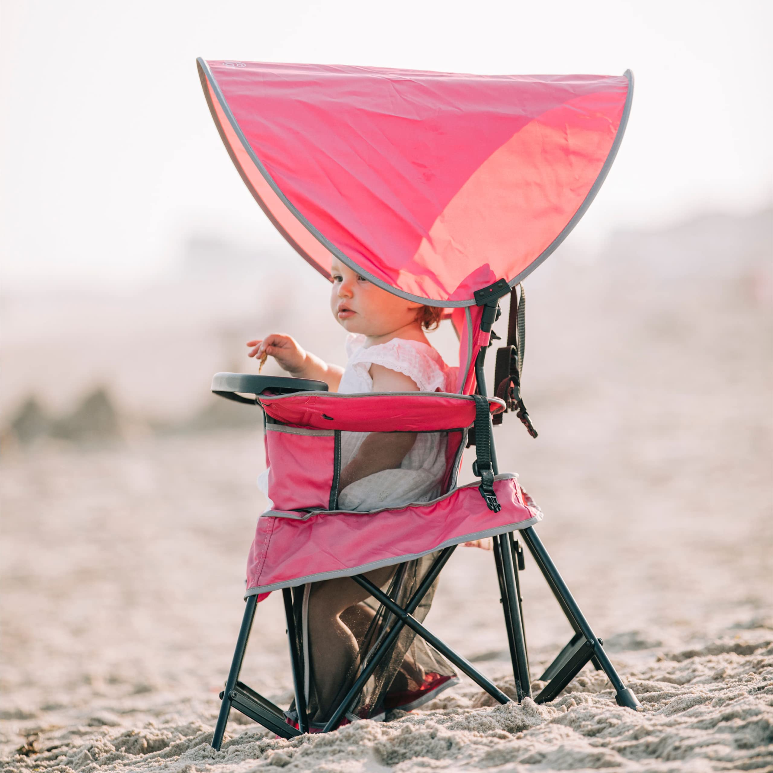 Indoor outdoor pink Baby Delight chair with canopy