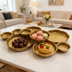 Gold finished serving bowls suitable as a cheese board display