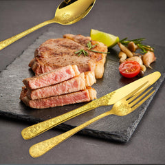 Gold floral embossed flatware close up image