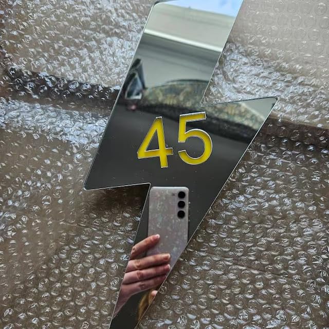 Decorative gold lightning bolt sign for doors or walls