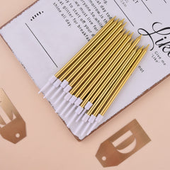 Gold birthday candles with holder