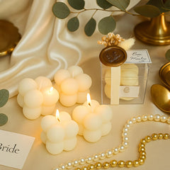 Decorative gold wax seal on candle