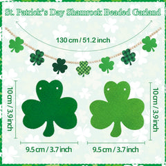 Close up of green shamrock cutouts on wooden bead garland