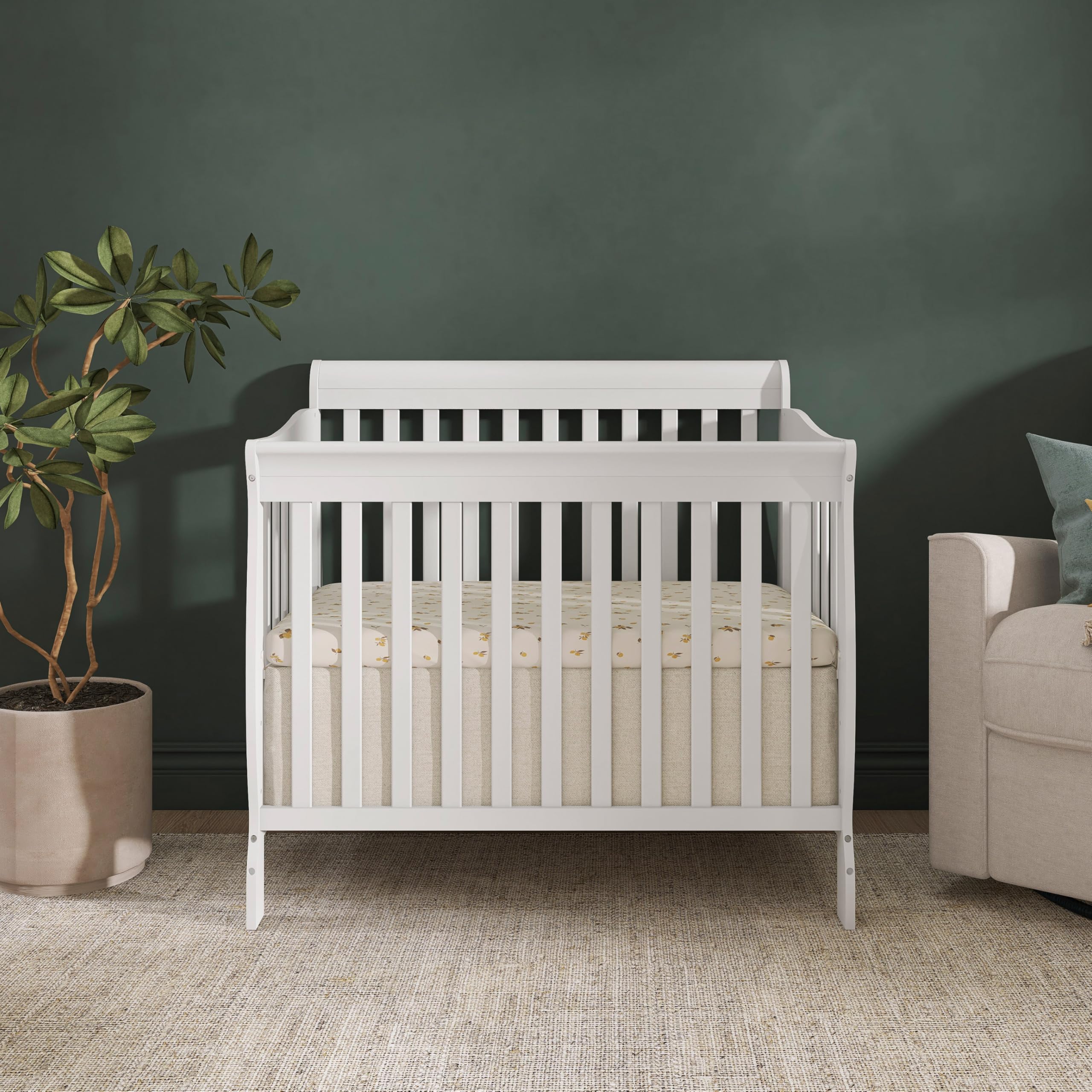 Includes 1-inch mattress pad with Aden crib