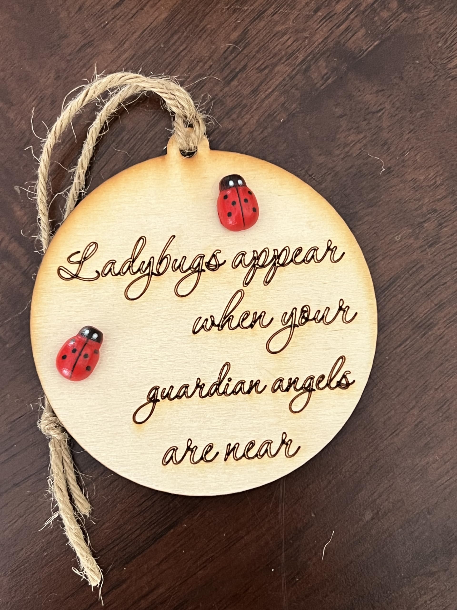 Twine hanging string on round wooden keepsake