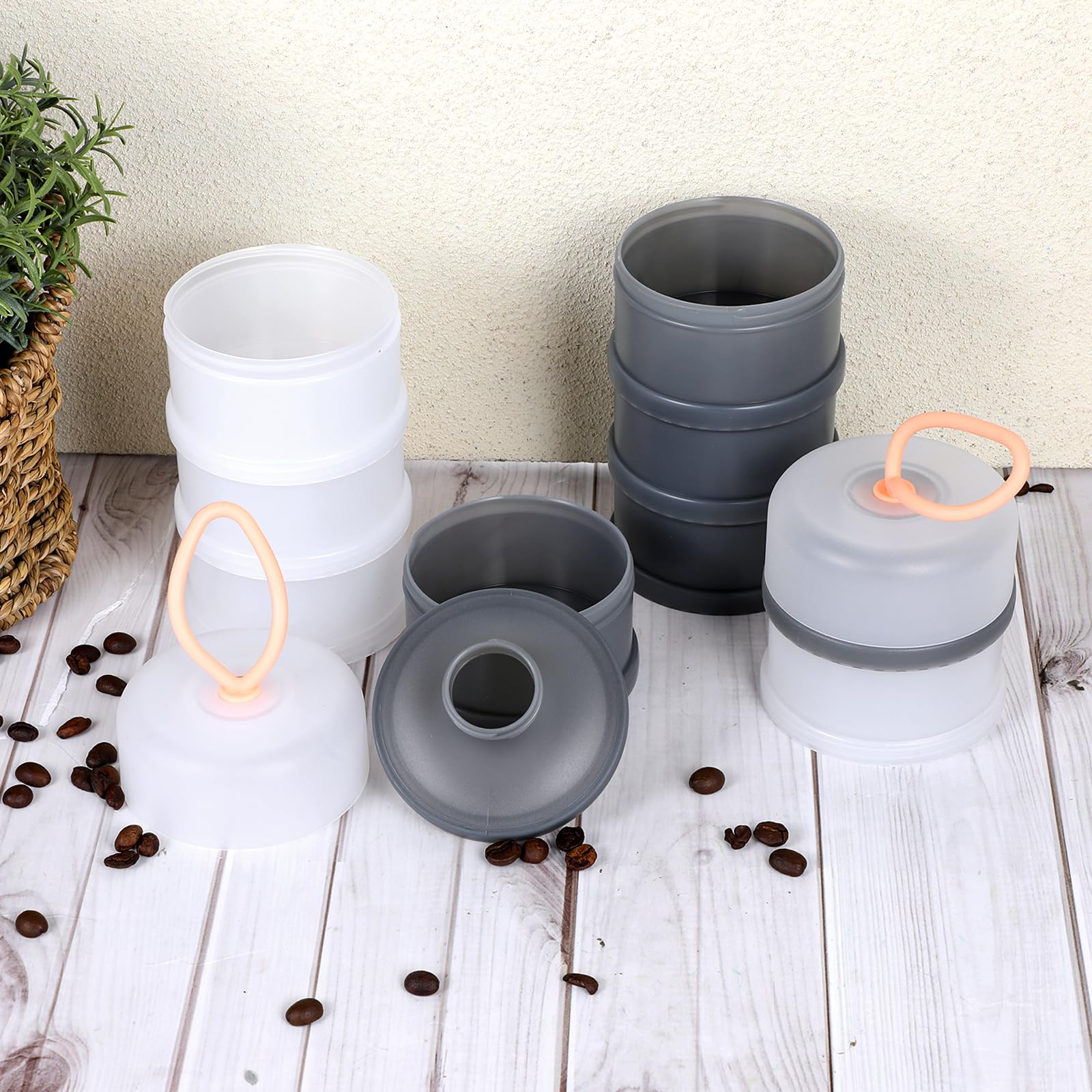 Set of 4 gray and white dispensing bottles for on-the-go storage