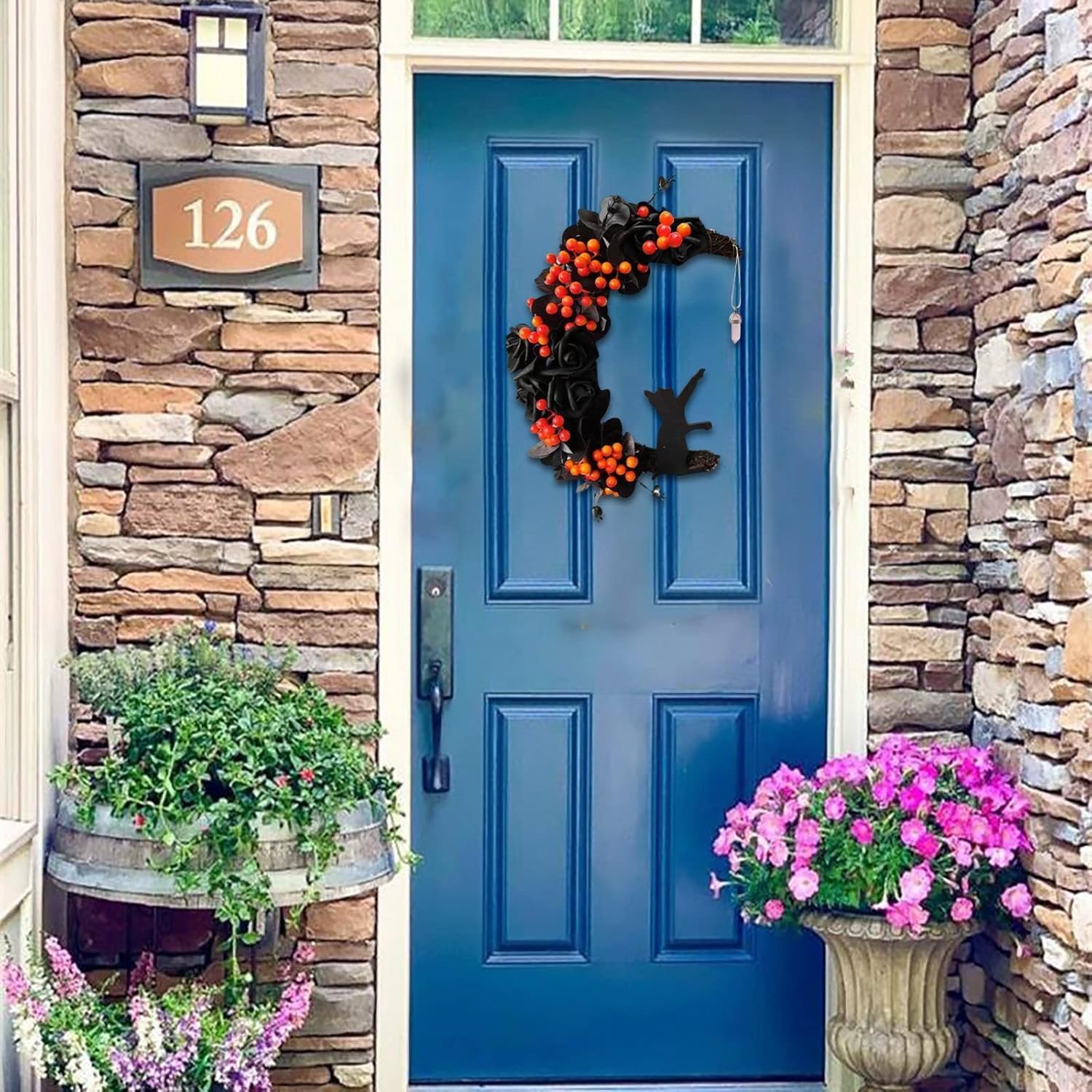 Orange Halloween wreath featuring moon and cat design