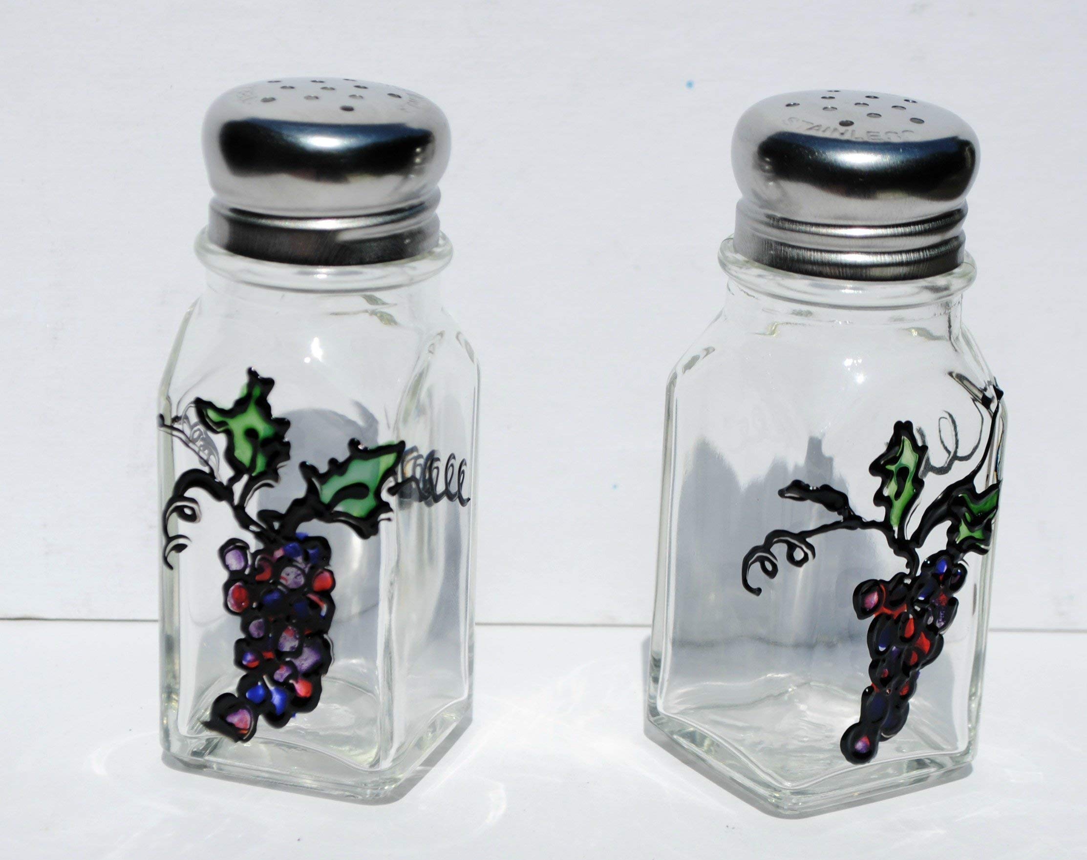 Glass salt and pepper shakers with silver tops featuring a stained glass grape design