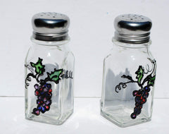Glass salt and pepper shakers with silver tops featuring a stained glass grape design