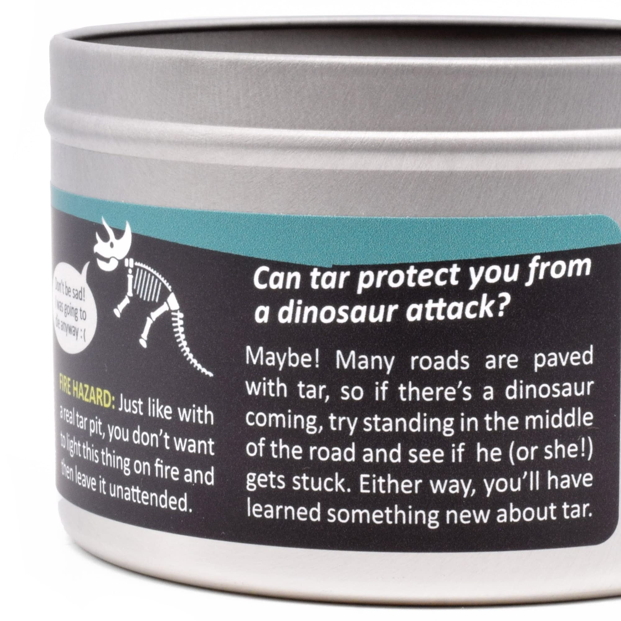 Decorative tar pit candle featuring dinosaurs