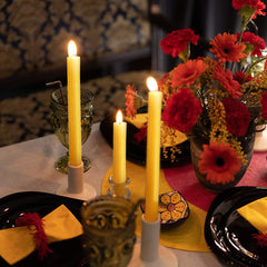 hand-rolled beeswax taper candles with honeycomb texture