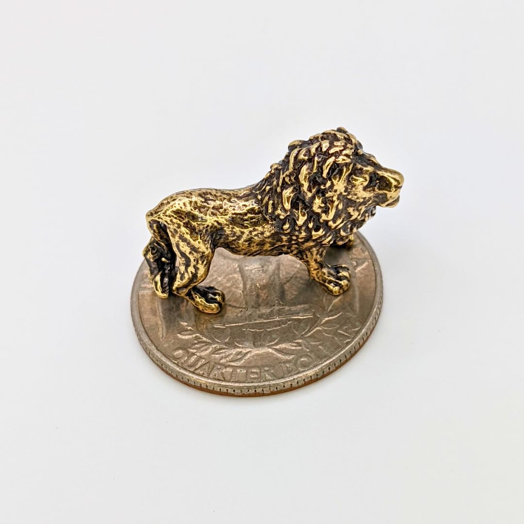 Small brass lion figurine with regal gaze