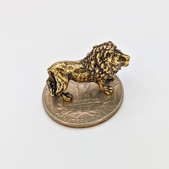 Small brass lion figurine with regal gaze