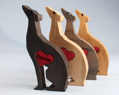 Handcarved Heart dog sculpture in oak wood