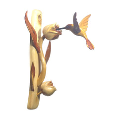 Handcrafted wooden hummingbird wall sculpture on natural branch base